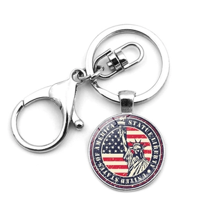 Silver metal keychain featuring Statue of Liberty and USA flag with lobster clasp closure