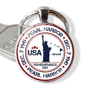 Detail of Pearl Harbor Memorial keychain with Statue of Liberty and USA flag colors