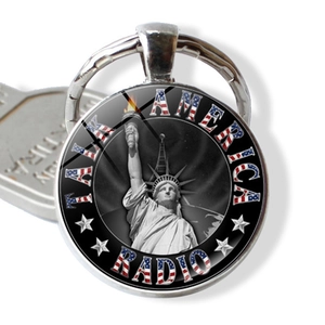 Detailed close-up of a New York souvenir keychain featuring the Statue of Liberty and USA flag