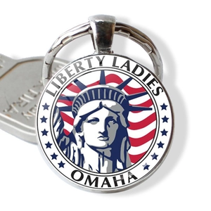 Detail of silver souvenir keychain featuring Lady Liberty and the text Liberty Ladies
