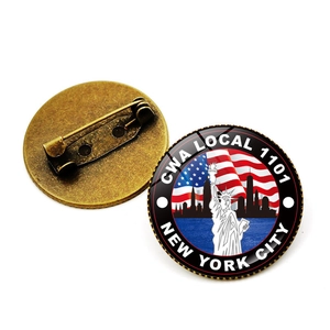 Vintage Statue of Liberty and US flag metal lapel pin badge with New York skyline design