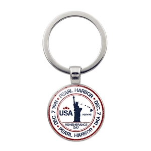 Detail of silver Pearl Harbor memorial keychain with USA flag and Hawaii engraving