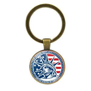 Detailed macro view of bronze Statue of Liberty keychain with American flag emblem