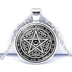 Detail of Wiccan Rede text and Celtic Knot pentagram pendant in silver metal