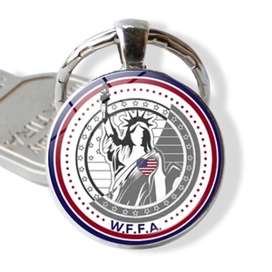 New York souvenir keychain featuring Statue of Liberty and US flag heart design in silver metal