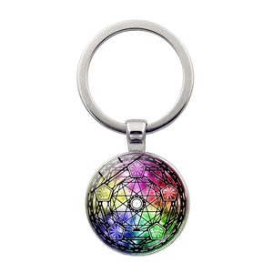 Detail of silver mystical mandala glass dome keychain with sacred geometry pattern