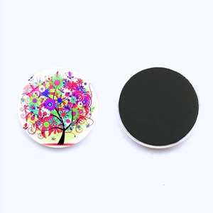 Macro view of front and back of 25mm Tree of Life glass fridge magnet with magnetic backing