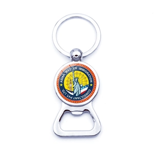 Detailed view of silver metal keychain bottle opener with colorful landmark logo inlay