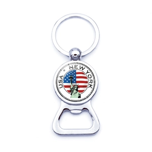 Detail of metal Statue of Liberty bottle opener keychain with New York US flag pattern