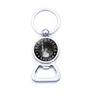 Close-up of vintage Statue of Liberty metal bottle opener keychain with glossy silver finish