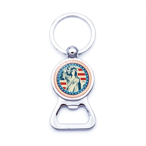 Detailed view of metal bottle opener keychain with Statue of Liberty souvenir emblem