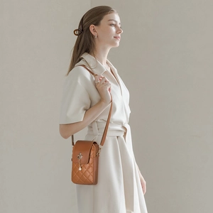 Quilted brown mini crossbody phone bag with elegant pearl crown pendant for women