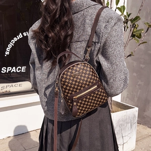 Classic dark brown printed backpack with vintage geometric patterns and gold zipper accents