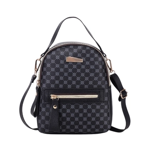 Minimalist black printed mini backpack with floral geometric patterns and top handle
