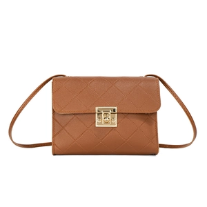 Brown quilted crossbody bag with gold square metal clasp and chain strap on white background