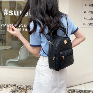 Classic black quilted small backpack for women with gold hardware and adjustable straps