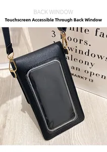 Detail of the back touch screen window on black leather mobile phone crossbody bag