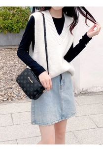 Crossbody small square bag in black leather featuring embossed pattern and gold logo
