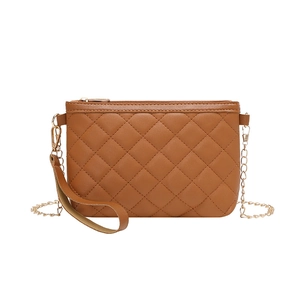 Caramel brown quilted crossbody camera bag with gold chain strap and wristlet