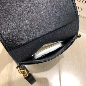 Black cross-grain leather touch screen phone bag with gold hardware and shoulder strap