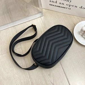Chic black quilted crossbody waist bag with golden hardware and adjustable nylon strap