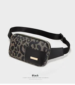 Detail of leopard print running fanny pack with black leather and gold metal trim