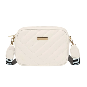 Minimalist beige quilted crossbody bag with golden hardware and wide striped shoulder strap