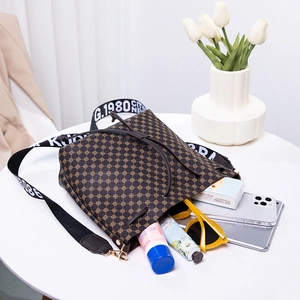 Retro brown bucket bag with geometric prints, wide shoulder strap and spacious interior