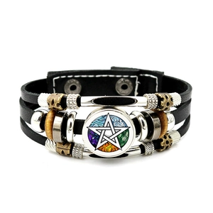 Detail of multi-layer braided leather bracelet with pentagram charm and vintage beads