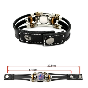 Multilayer braided leather bracelet featuring a colorful hummingbird charm and metal beads