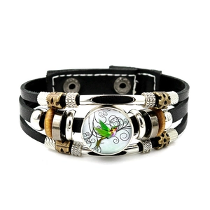 Detailed view of multilayer leather bracelet with hummingbird glass cabochon and beads
