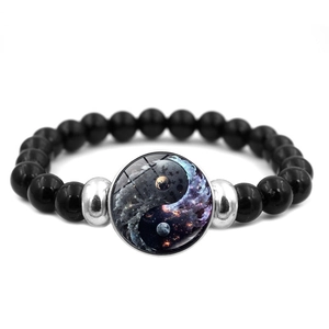 Yin Yang Tai Chi beaded bracelet with black polished stones and a cosmic galaxy motif