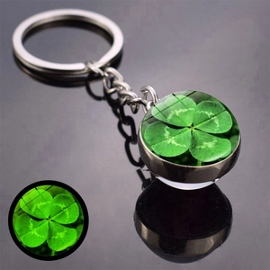 Luminous four-leaf clover glass ball keychain with glowing double-sided emerald lucky charm