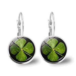 Detail of silver clover earrings featuring green clover motifs and lever-back closures