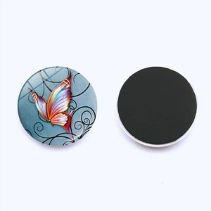 Detailed view of 25mm round glass butterfly fridge magnet with black magnetic backing