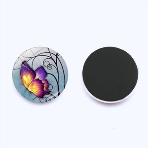 Detailed view of 25mm butterfly glass fridge magnet showing its glass dome and magnetic back