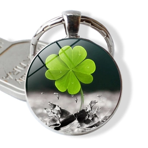 Lucky four-leaf clover keychain with polished silver alloy frame and glass gemstone