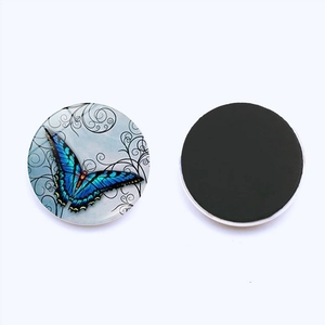 25mm glass fridge magnet featuring blue butterfly pattern and black magnetic back