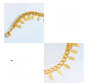 Detail of 18K gold plated titanium steel leaf tassel bracelet with high polish finish