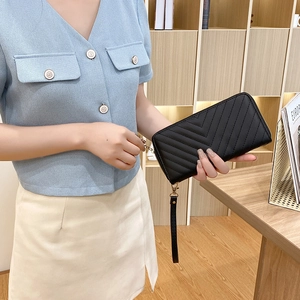 Women's black long wallet with V-quilted faux leather and detachable wristlet strap