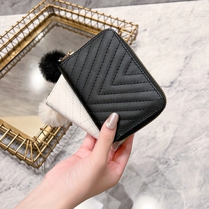 Chic V-quilted small faux leather clutch purses with pompom charms in black and white