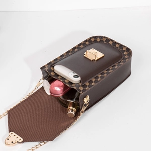 Vintage geometric print crossbody phone bag with gold chain and internal capacity view