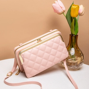 Pale pink quilted crossbody phone wallet bag with gold hardware and zipper