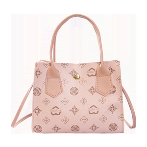 Close-up of heart pattern print and B. yang branding on textured leather handbag