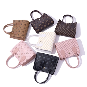 Detailed collection of seven PU leather tote bags with various vintage prints and dual handles