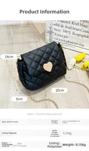 Detail of black quilted crossbody bag with golden heart lock and chain strap (20x6x14cm)