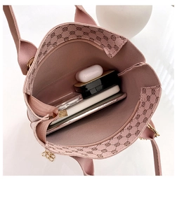 Top view of pink leather tote bag showing spacious interior with zipper closure