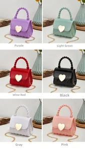 Detailed grid view of mini heart-shaped jelly bags in purple, green, burgundy, and pink