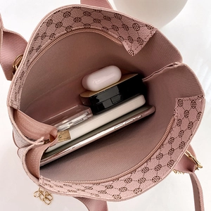 Pink printed hobo bag with clover pattern showing spacious interior for daily essentials