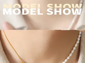 Detail of layered gold snake chain and natural freshwater pearls on a female model